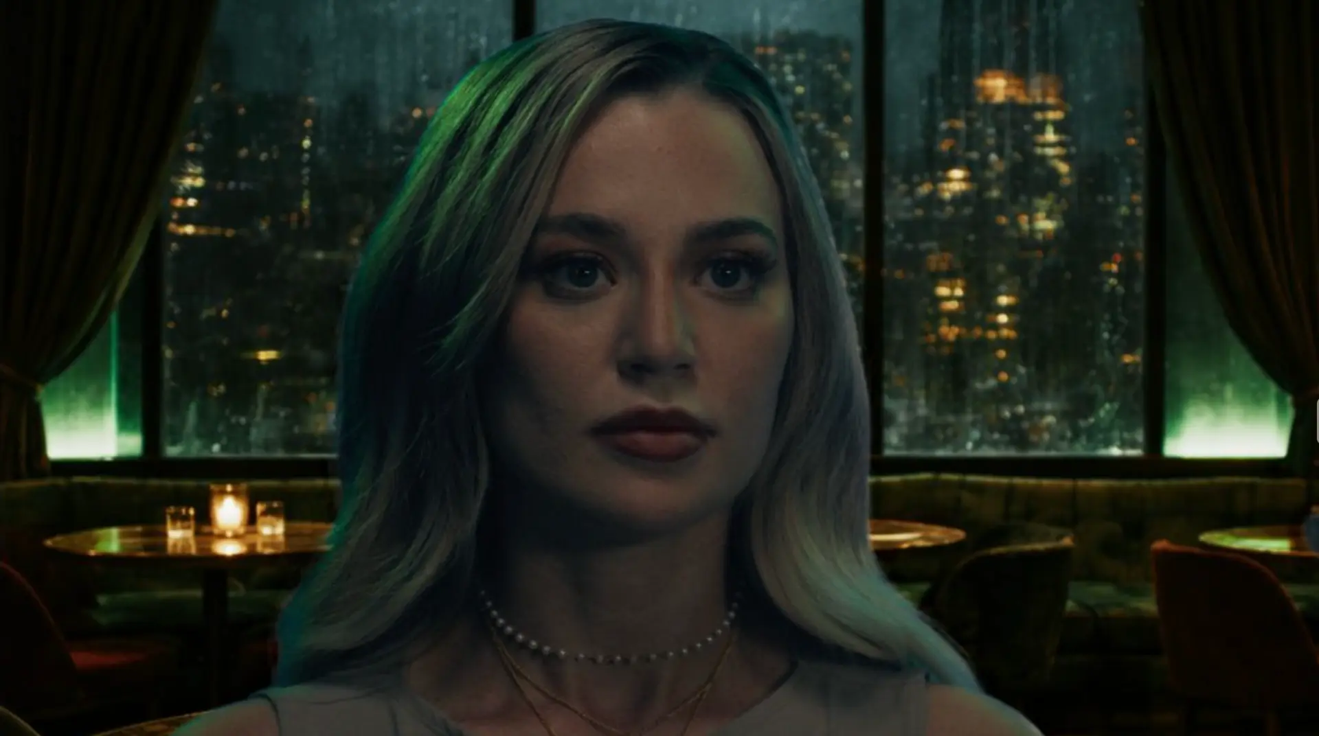 In-game scene: Natasha in a lounge above the city skyline